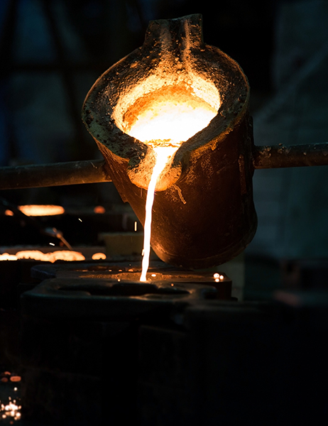 Pouring non-ferrous metal from a crucible into a sand mold