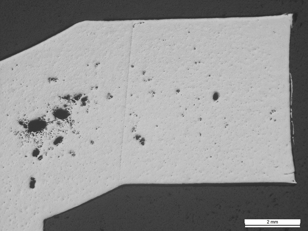 multiple casting defects shown in aluminum microstructure imaging