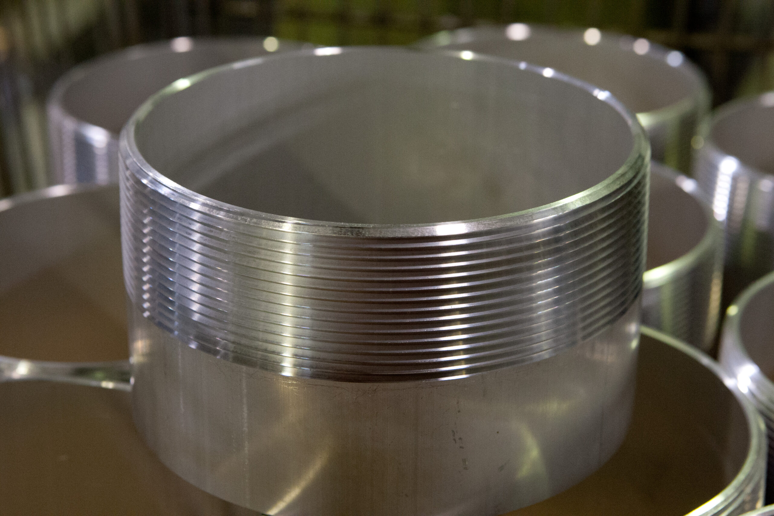 Aluminum cylinders with a threaded exteriors.