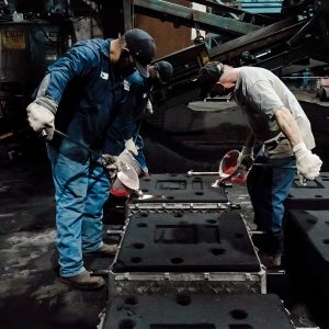 Ermak Pouring molten aluminum into sand cast mold
